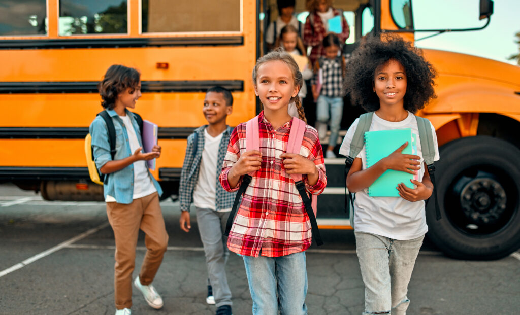children near school bus